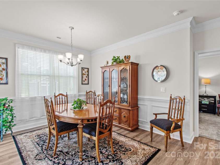 117 Cup Chase Drive, Mooresville, NC 28115.  MLS# CAR4279101, YatesRealty ID 25558. Bright Dining Area with wainscotting, 9' ceilings, crown molding
