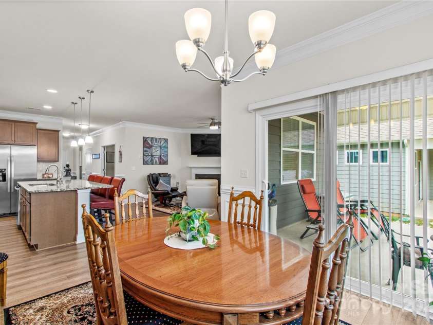 117 Cup Chase Drive, Mooresville, NC 28115.  MLS# CAR4279101, YatesRealty ID 25558. Dining area opens to covered patio