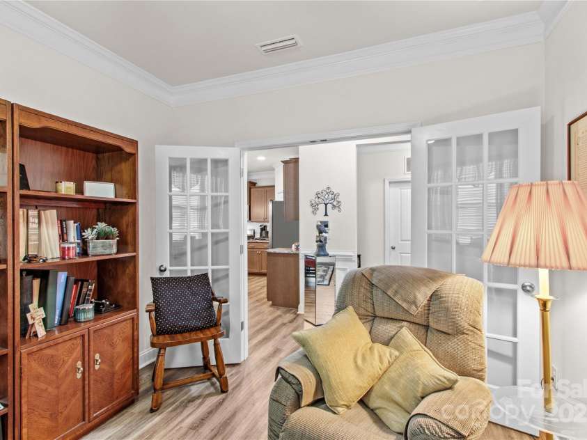 117 Cup Chase Drive, Mooresville, NC 28115.  MLS# CAR4279101, YatesRealty ID 25558. Flex Room (office, bedroom, playroom, craft room) with crown molding, french doors, LVP flooring