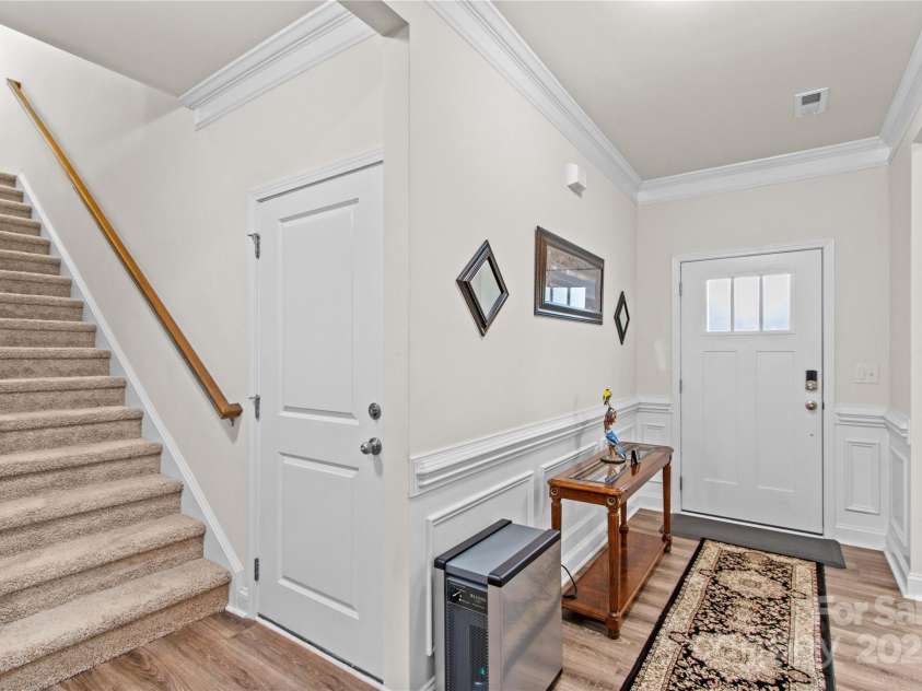 117 Cup Chase Drive, Mooresville, NC 28115.  MLS# CAR4279101, YatesRealty ID 25558. Foyer/Entrance Crown molding, wainscotting, LVP flooring