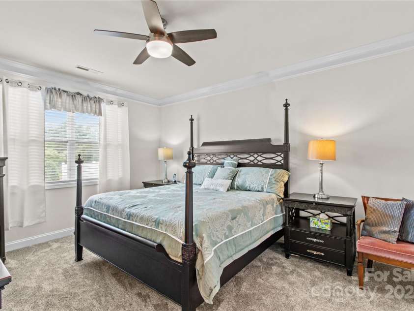 117 Cup Chase Drive, Mooresville, NC 28115.  MLS# CAR4279101, YatesRealty ID 25558. Primary bedroom with crown molding, ceiling fan,  new carpeting & underpadding