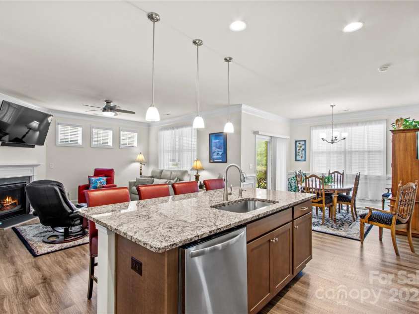 117 Cup Chase Drive, Mooresville, NC 28115.  MLS# CAR4279101, YatesRealty ID 25558. The open floorplan creates a seamless flow between the kitchen, dining, and living areas—perfect for staying involved with guests or family at all times.