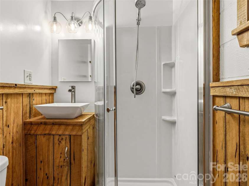200 River Ridge Drive, Burnsville, NC 28714.  MLS# CAR4381745, YatesRealty ID 25559. Downstairs Bathroom (access through utility room)