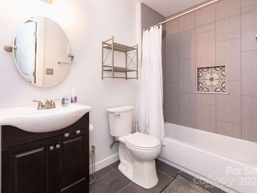 14 New Bern Drive, Fletcher, NC 28732.  MLS# CAR4277461, YatesRealty ID 25567. Full bath in studio apartment