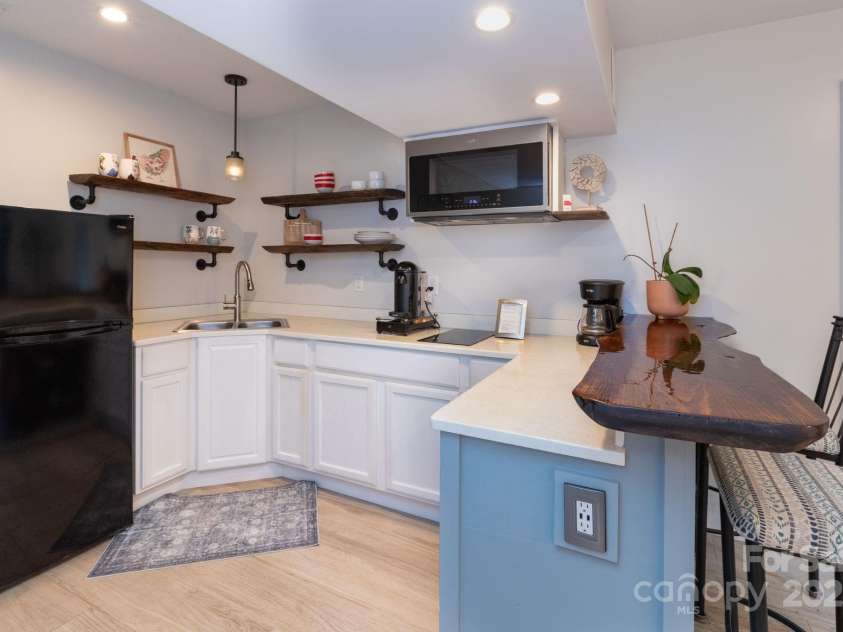 14 New Bern Drive, Fletcher, NC 28732.  MLS# CAR4277461, YatesRealty ID 25567. Kitchen area in studio apartment