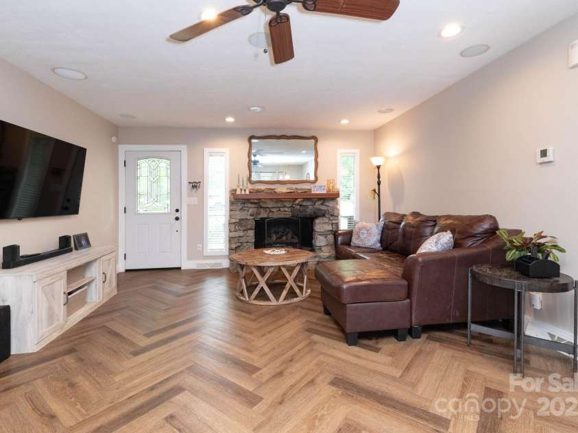 14 New Bern Drive, Fletcher, NC 28732.  MLS# CAR4277461, YatesRealty ID 25567. Living room with gas fireplace