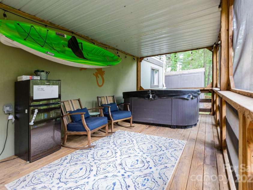 14 New Bern Drive, Fletcher, NC 28732.  MLS# CAR4277461, YatesRealty ID 25567. Screened porch under back deck - hot tub conveys