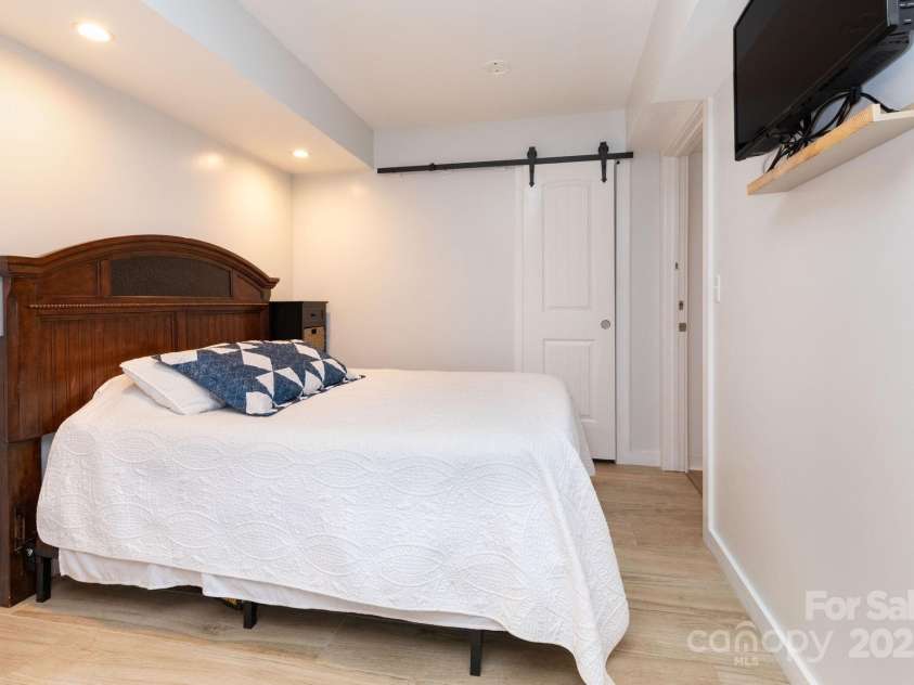 14 New Bern Drive, Fletcher, NC 28732.  MLS# CAR4277461, YatesRealty ID 25567. Sleeping area in studio apartment