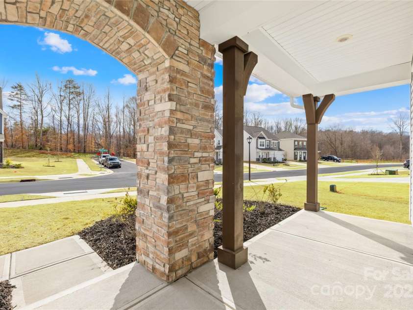 367 Kennerly Center Drive, Mooresville, NC 28115.  MLS# CAR4231882, YatesRealty ID 2557. Covered front porch w/ stone archway