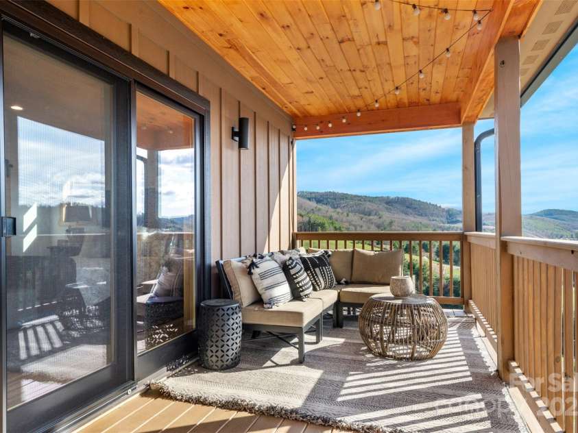 527 Cedar Trail, Fleetwood, NC 28626.  MLS# CAR4271536, YatesRealty ID 25576. Access to deck from primary suite