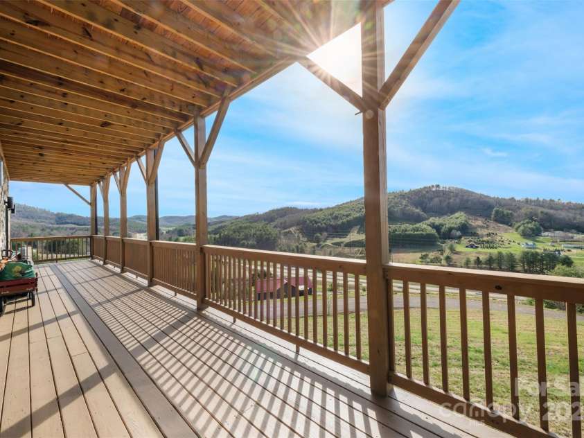 527 Cedar Trail, Fleetwood, NC 28626.  MLS# CAR4271536, YatesRealty ID 25576. Downstairs deck