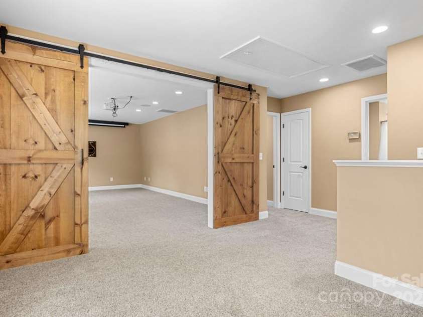 7545 Haley Lane, Indian Land, SC 29707.  MLS# CAR4215589, YatesRealty ID 25577. Flex/theatre room view from landing area/loft space