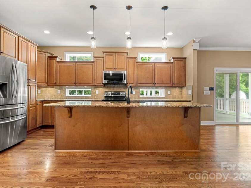 7545 Haley Lane, Indian Land, SC 29707.  MLS# CAR4215589, YatesRealty ID 25577. Kitchen open to family room and dining area