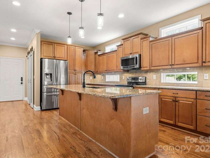 7545 Haley Lane, Indian Land, SC 29707.  MLS# CAR4215589, YatesRealty ID 25577. Kitchen open to family room and dining area