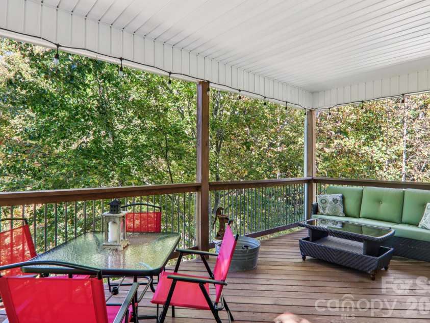 6 Wagon Trace, Flat Rock, NC 28731.  MLS# CAR4374692, YatesRealty ID 25583. Covered porch off primary bedroom