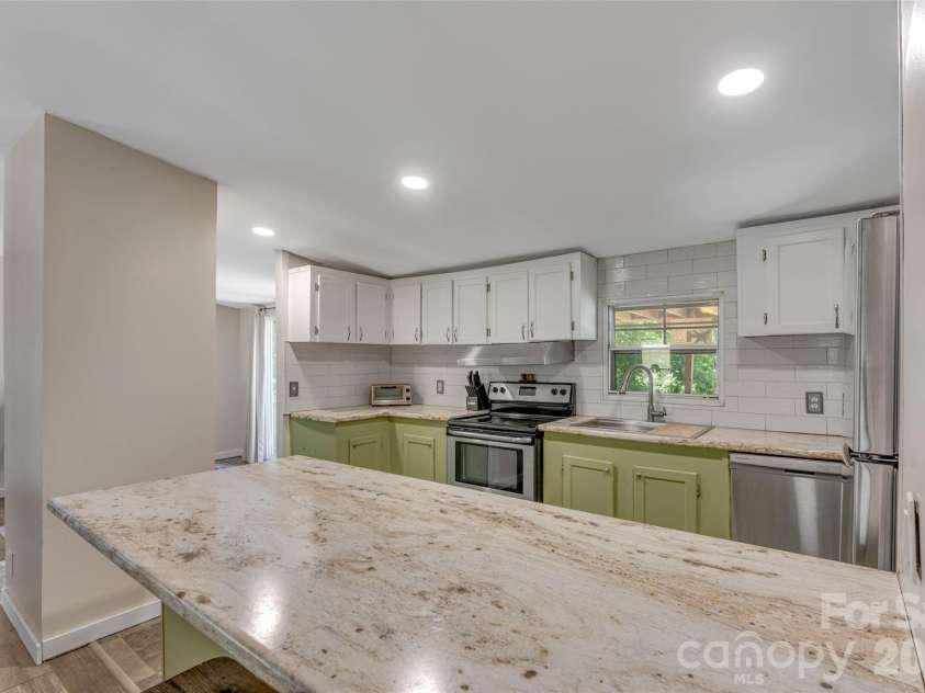 5029 Mundy Lane, Denver, NC 28037.  MLS# CAR4379646, YatesRealty ID 25585. Kitchen has large counter space for bar seating/eating