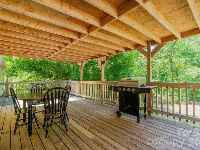 5029 Mundy Lane, Denver, NC 28037.  MLS# CAR4379646, YatesRealty ID 25585. Large rear deck partially covered overlooking your acreage 