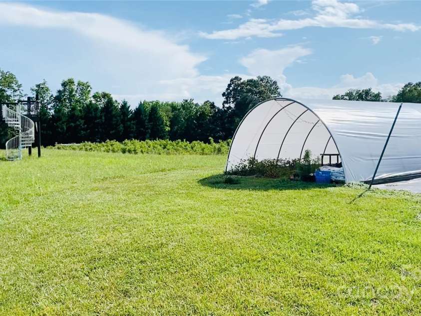 5188 Dysartsville Road, Morganton, NC 28655.  MLS# CAR4270470, YatesRealty ID 25587. Hoophouse before Hurricane Helene