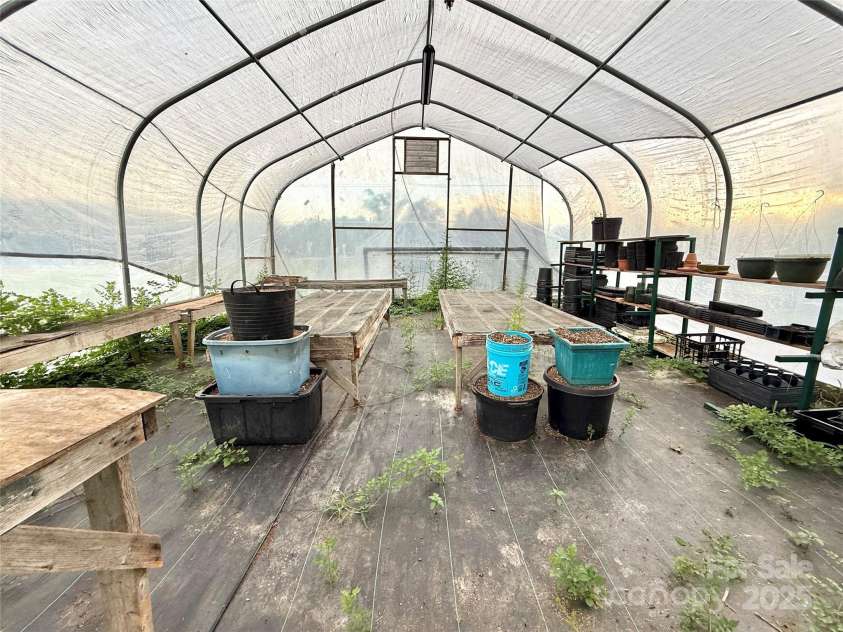 5188 Dysartsville Road, Morganton, NC 28655.  MLS# CAR4270470, YatesRealty ID 25587. Inside greenhouse