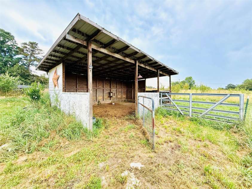 5188 Dysartsville Road, Morganton, NC 28655.  MLS# CAR4270470, YatesRealty ID 25587. Pole barn perfect for your goats to help keep, the land that runs parallel with the driveway, cleared.