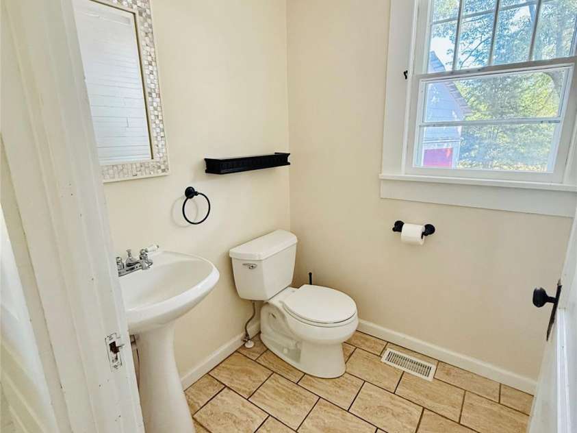 5188 Dysartsville Road, Morganton, NC 28655.  MLS# CAR4270470, YatesRealty ID 25587. Powder room off the mud room at back entry