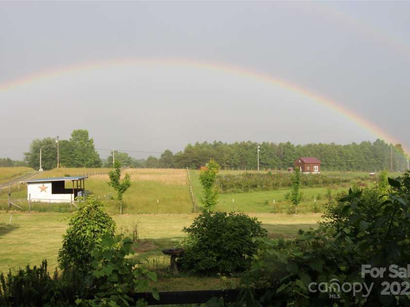 5188 Dysartsville Road, Morganton, NC 28655.  MLS# CAR4270470, YatesRealty ID 25587. Rainbow view from front porch. Pole barn to the left in picture