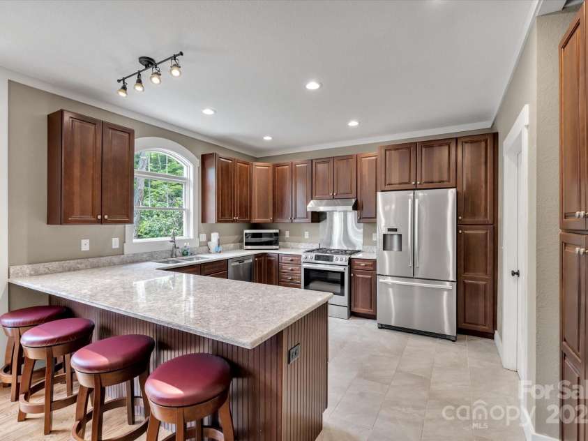 232 Sanctuary Way, Marshall, NC 28753.  MLS# CAR4151690, YatesRealty ID 2559. Ample kitchen with gas range