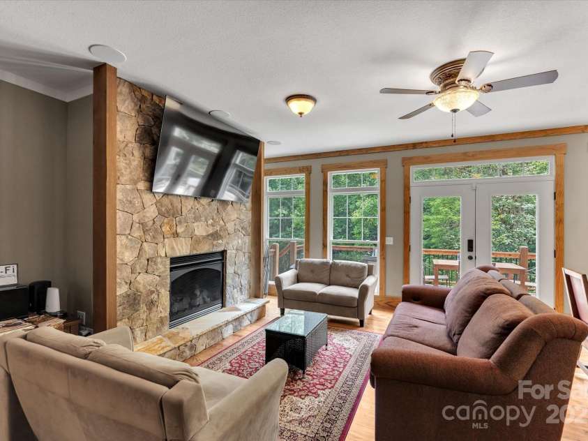 232 Sanctuary Way, Marshall, NC 28753.  MLS# CAR4151690, YatesRealty ID 2559. Cozy living room with gas fireplace.