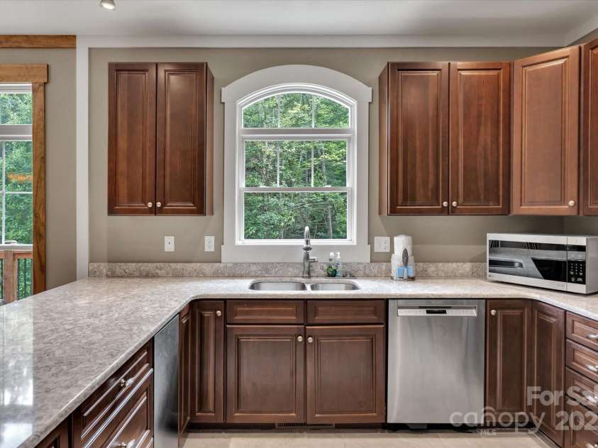 232 Sanctuary Way, Marshall, NC 28753.  MLS# CAR4151690, YatesRealty ID 2559. Kitchen overlooks the private backyard.