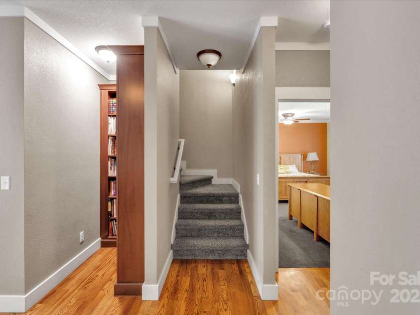 232 Sanctuary Way, Marshall, NC 28753.  MLS# CAR4151690, YatesRealty ID 2559. Reading nook, stairs to upper level & door to primary bedroom