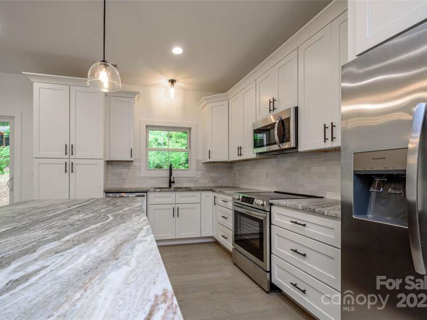 118 Laurel Lane, Etowah, NC 28729.  MLS# CAR4258432, YatesRealty ID 25594. Leathered Countertops
