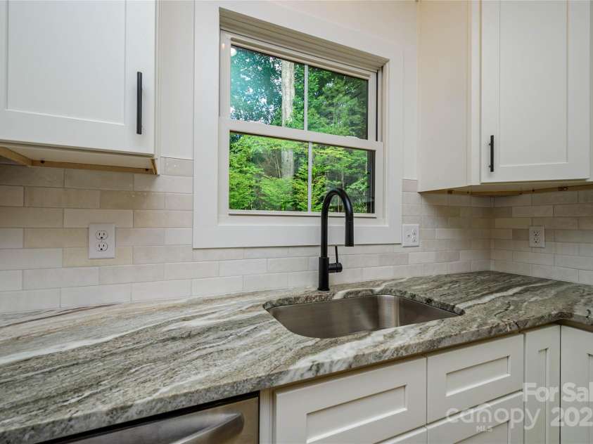 118 Laurel Lane, Etowah, NC 28729.  MLS# CAR4258432, YatesRealty ID 25594. Nice Natural view outside the Kitchen Window