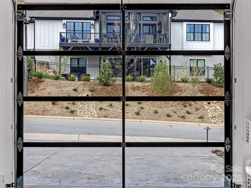 11 Bayonne Trail, Asheville, NC 28804.  MLS# CAR4250937, YatesRealty ID 256. Garage doors allow looking out, but not in