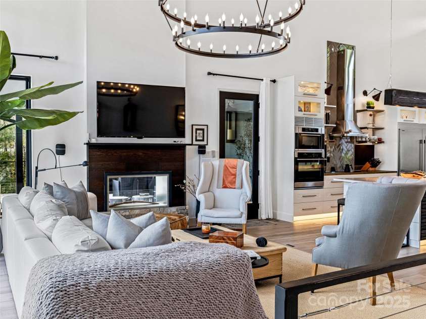 11 Bayonne Trail, Asheville, NC 28804.  MLS# CAR4250937, YatesRealty ID 256. Two sided fireplace in the living area