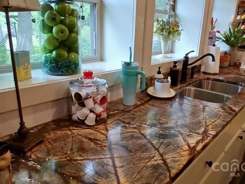 45 Gracious Lane, Waynesville, NC 28785.  MLS# CAR4255270, YatesRealty ID 25600. Brazilian rainforest granite
