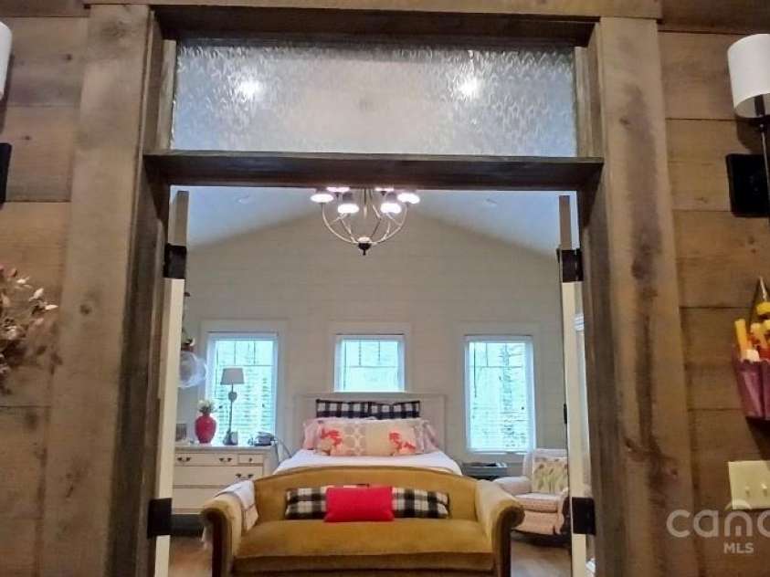 45 Gracious Lane, Waynesville, NC 28785.  MLS# CAR4255270, YatesRealty ID 25600. Enter the Elegant Primary Suite