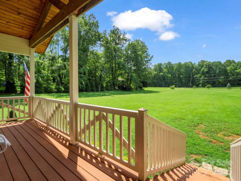 3540 Fork Creek Road, Saluda, NC 28773.  MLS# CAR4294391, YatesRealty ID 25602. Front porch (1 of 3) Maybe one of the only spacious 