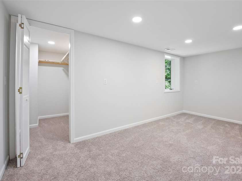 15 Josie Lane, Asheville, NC 28804.  MLS# CAR4267663, YatesRealty ID 25606. 2nd bedroom on lower level (just under 7' ceiling height)