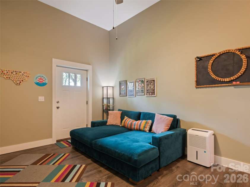 221 Northside Street, Canton, NC 28716.  MLS# CAR4378671, YatesRealty ID 25609. Large den on lower level with elevated ceilings and access to back yard