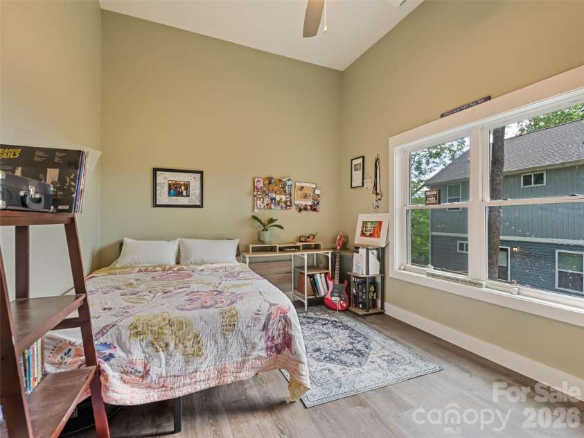 221 Northside Street, Canton, NC 28716.  MLS# CAR4378671, YatesRealty ID 25609. Lower level bedroom with elevated ceilings and mountain views
