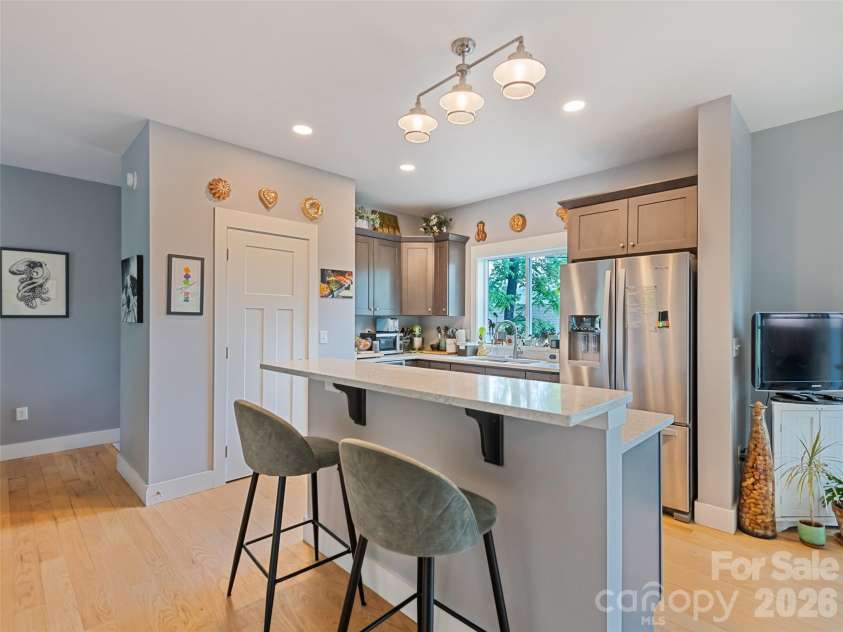 221 Northside Street, Canton, NC 28716.  MLS# CAR4378671, YatesRealty ID 25609. Well appointed kitchen with elevated island dining