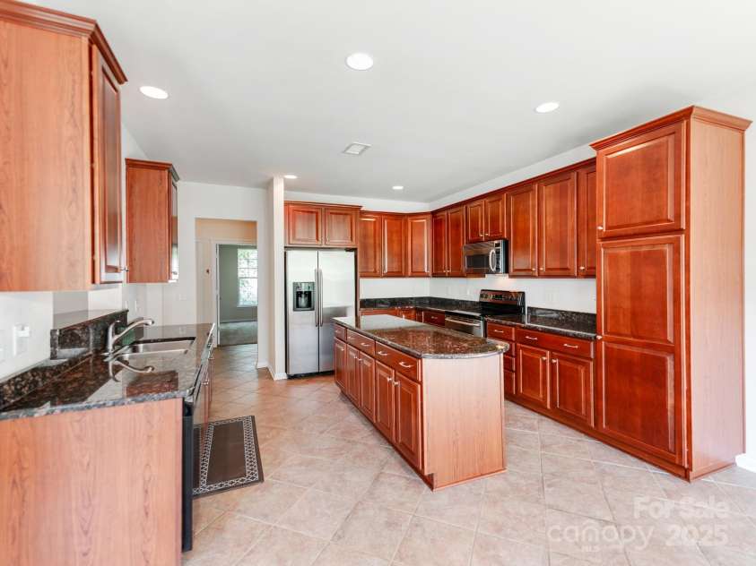15001 Rosemary Way Drive, Huntersville, NC 28078.  MLS# CAR4260853, YatesRealty ID 25624. Nice Cherry Cabinets...