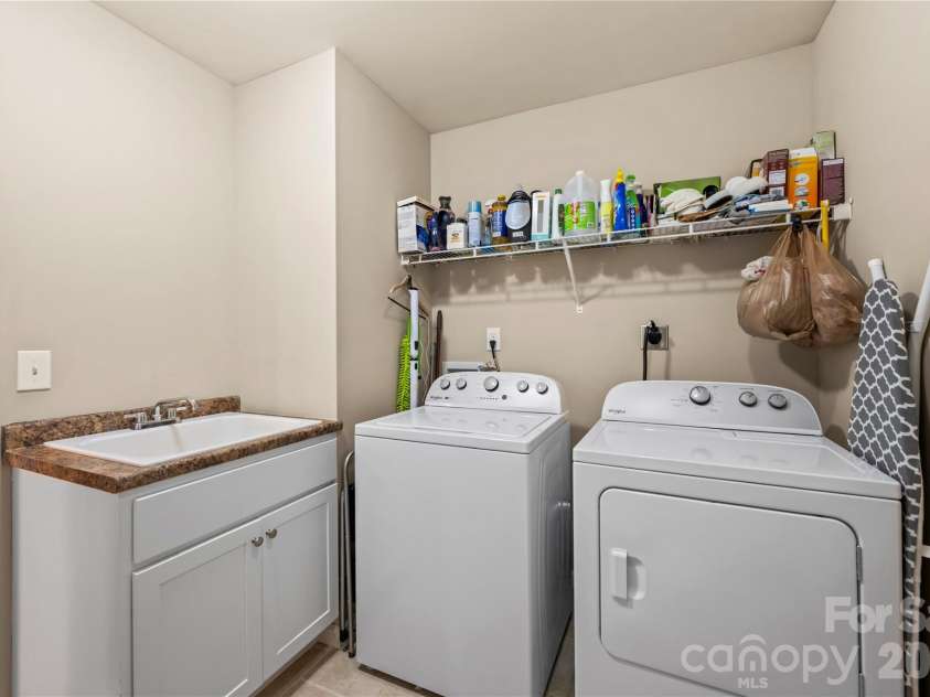 27 Pounding Mill Road, Hendersonville, NC 28792.  MLS# CAR4365219, YatesRealty ID 25624. Spacious laundry/mud room leading to garage.