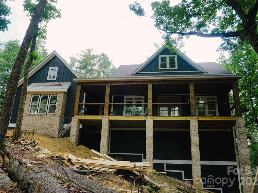 73 Summer Shade Court, Hendersonville, NC 28792.  MLS# CAR4272837, YatesRealty ID 25627. Massive Timberframe porch
