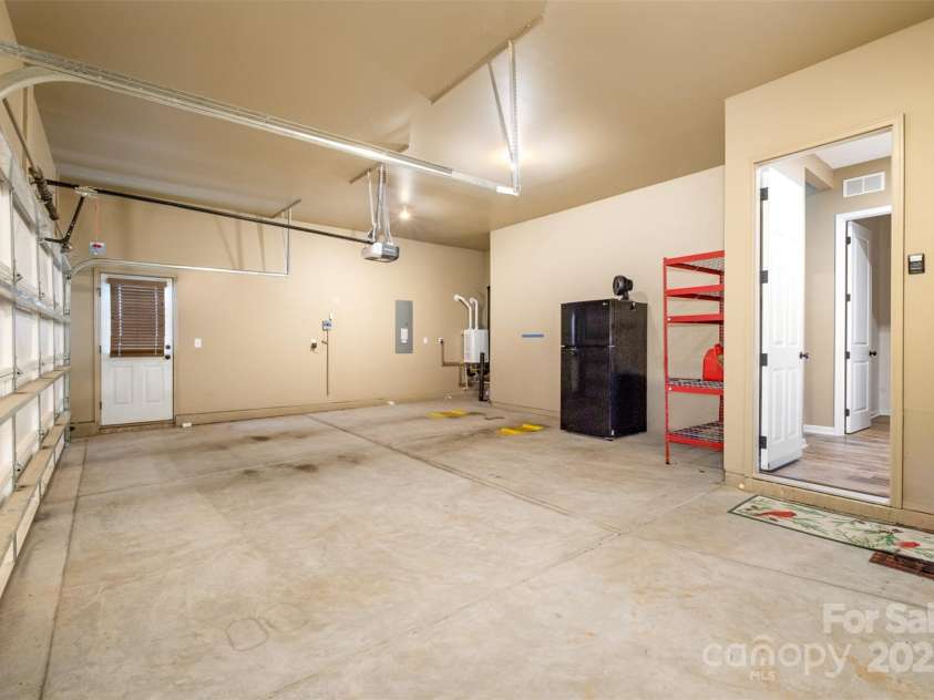 3105 Bonterra Boulevard, Indian Trail, NC 28079.  MLS# CAR4259704, YatesRealty ID 25628. Generous two-car garage