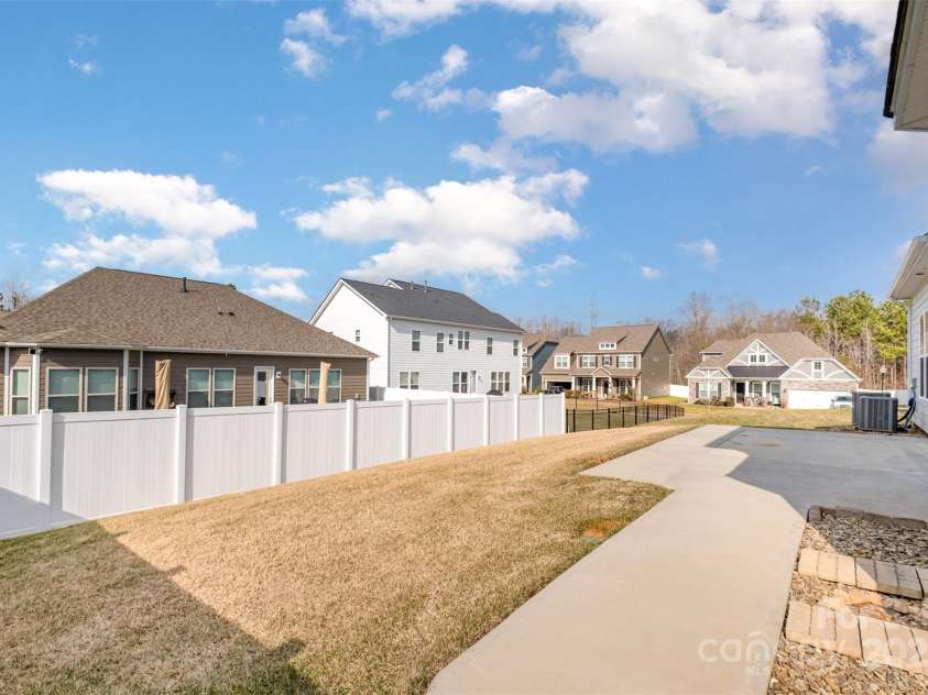 3105 Bonterra Boulevard, Indian Trail, NC 28079.  MLS# CAR4259704, YatesRealty ID 25628. Large patio with trash landing