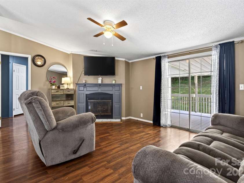 143 Diamond Cove, Nebo, NC 28761.  MLS# CAR4279762, YatesRealty ID 25637. Living room Fireplace