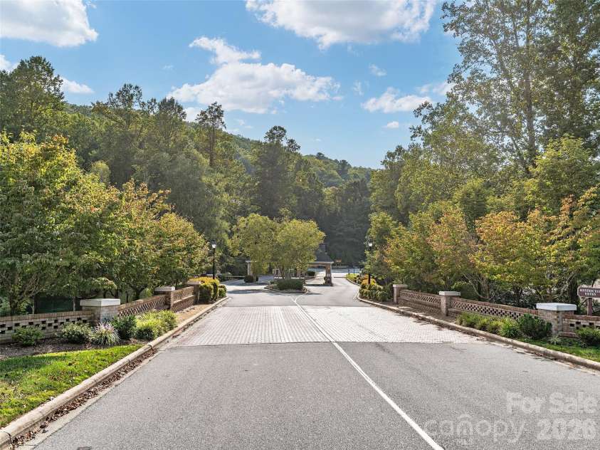 54 Deep Valley Lane, Hendersonville, NC 28791.  MLS# CAR4304196, YatesRealty ID 2564. Gated Entrance