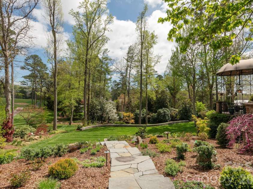 8 Fairway Place, Asheville, NC 28803.  MLS# CAR4245541, YatesRealty ID 2564. A winding stone walkway for relaxing and taking in the view.