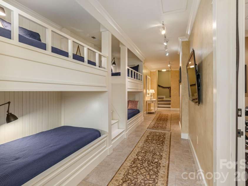 8 Fairway Place, Asheville, NC 28803.  MLS# CAR4245541, YatesRealty ID 2564. Custom-built bunk bed area. This multifunctional lower level balances utility with style.
